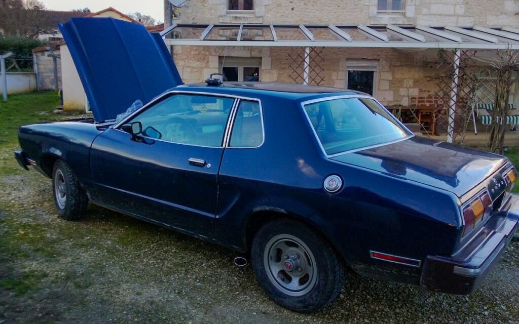 1978 Ford Mustang II Hardtop before restoration, original faded blue paint, project car condition