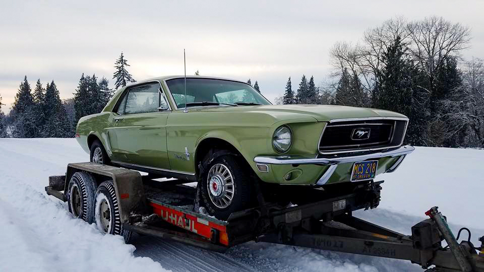 1968 Mustang Survivor arriving in Oregon on a flatbed truck in snowy conditions