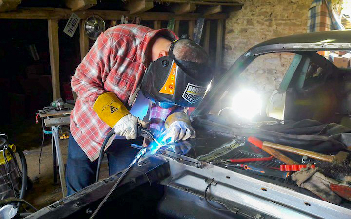 Learning by doing: with guidance from his brother-in-law, Rudy develops new skills, including welding work on the front of the fastback.