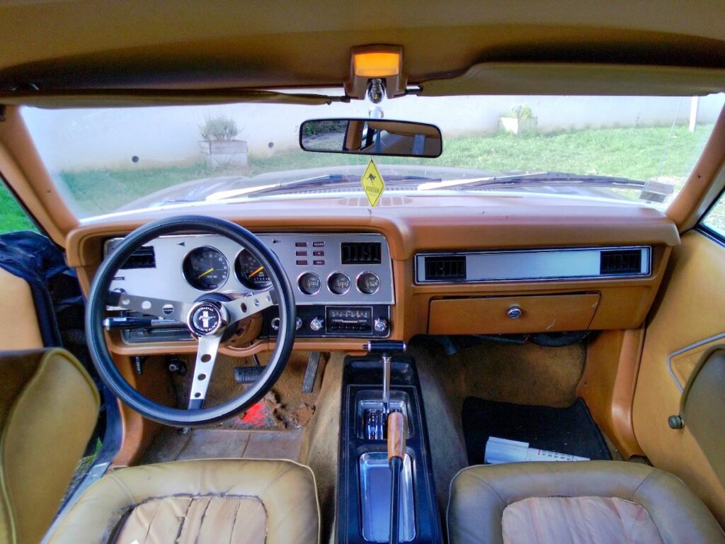 1978 Ford Mustang II interior with Grant steering wheel and aluminum dashboard, early restoration stage
