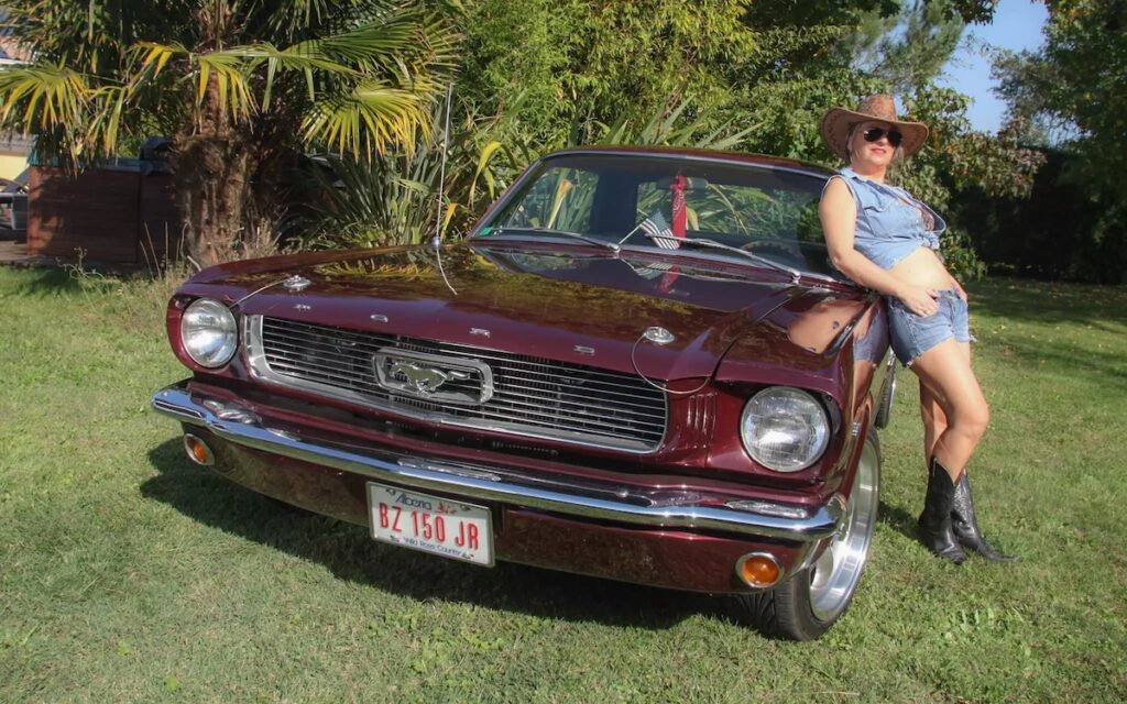 Sophie with her 1966 Mustang Vintage Burgundy coupe named Kelly, classic Mustang owner portrait