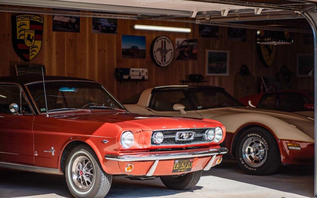1966 Mustang Emberglo arriving in France, parked next to Corvettes
