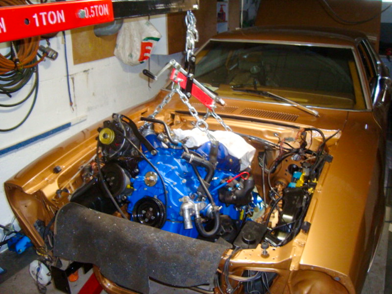 Installing the engine in a 1978 Ford Mustang II during restoration