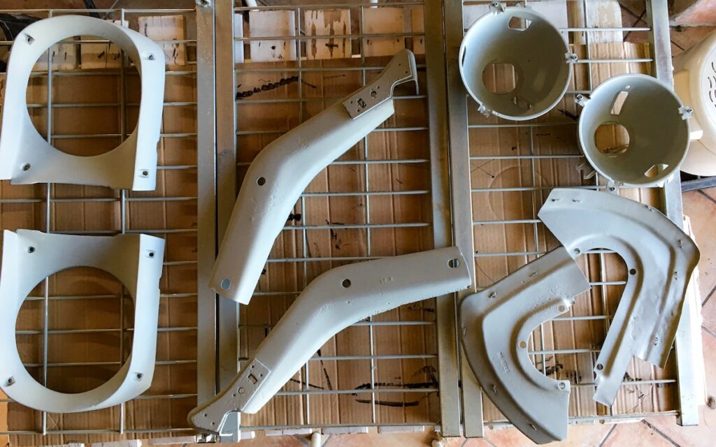 Restored parts from Chloe’s 1966 Mustang laid out during the rebuild process.