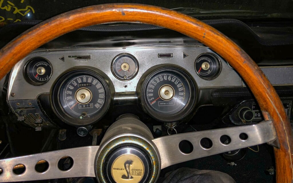 Interior dashboard of a 1967 Shelby GT500 with its original Shelby steering wheel