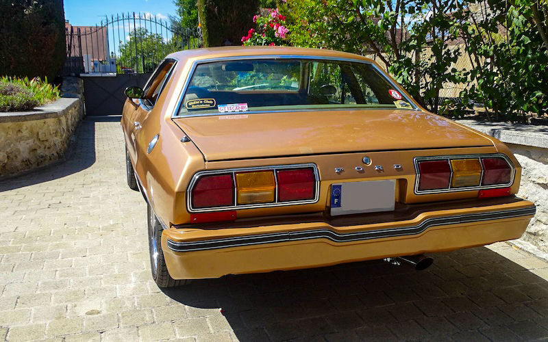Rear view of a restored 1978 Ford Mustang II with distinctive taillights