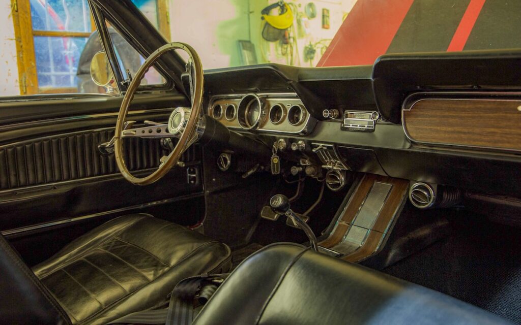 Restored interior of Chloe’s 1966 Mustang with period-correct details.