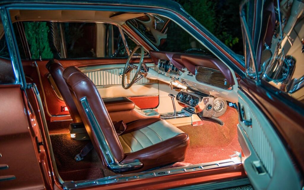 Interior of a 1966 Mustang Emberglo at night, automatic transmission