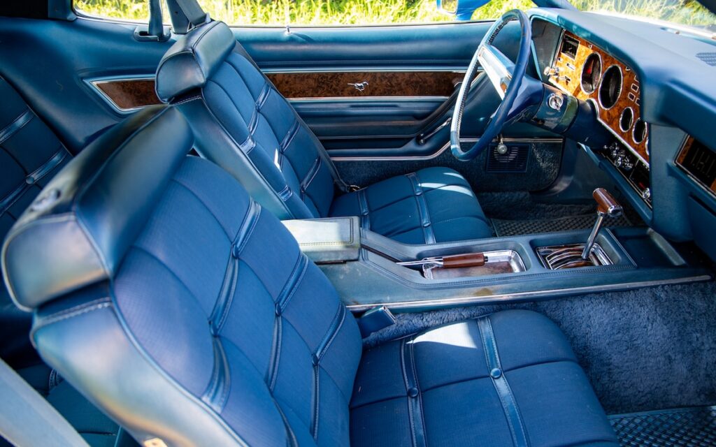 Blue velour bucket seats inside a 1974 Mustang II Ghia