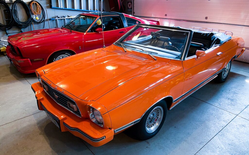 Mustang II Classic II parked in Robert’s garage next to a Mustang King Cobra.