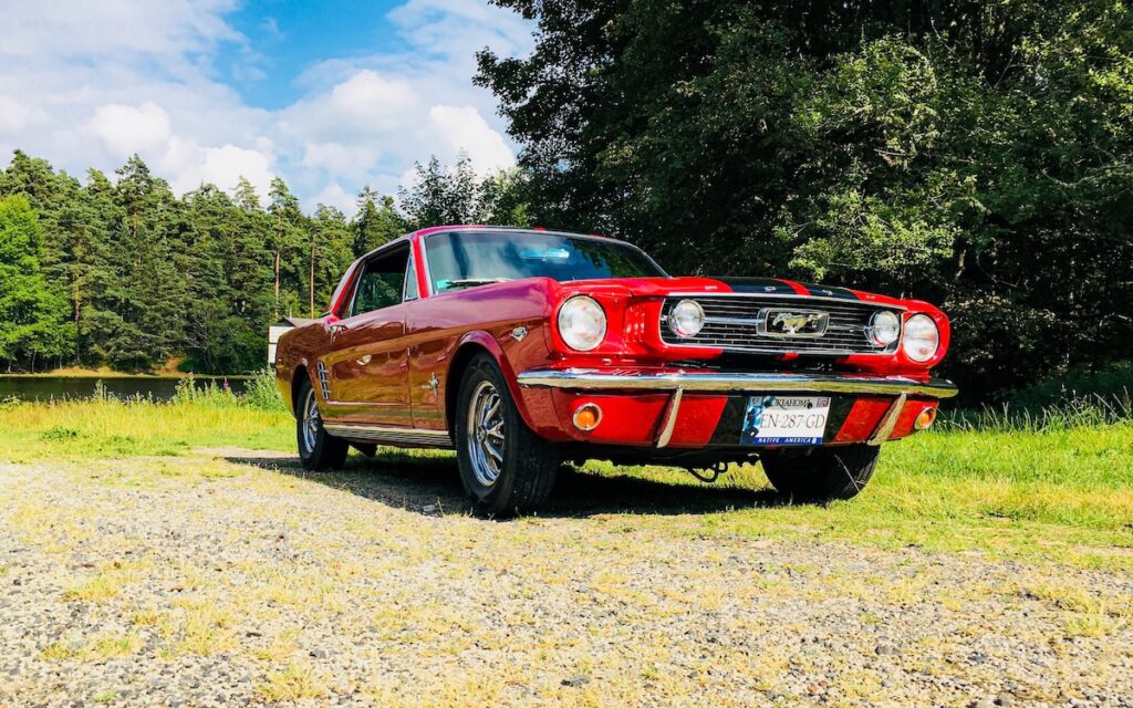 Chloe driving her restored 1966 Mustang on the roads of Puy-de-Dôme, France.