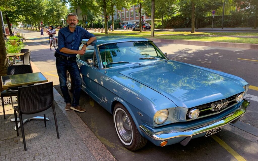 Stefan and his fully restored 1965 Mustang Coupe, reunited after a long journey and countless hours of work.
