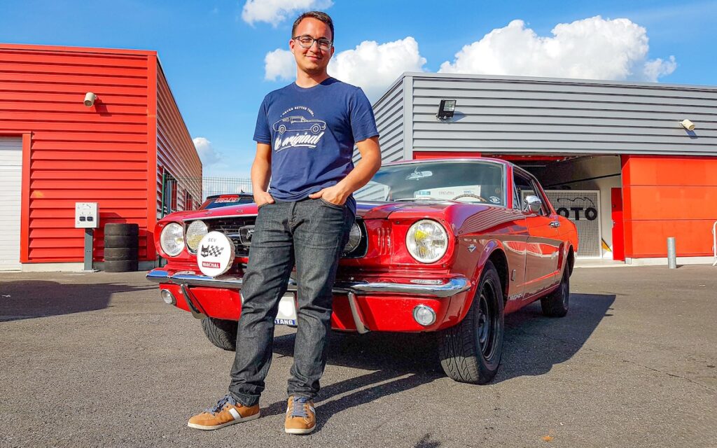 Owner standing next to his Mustang GT 1966 Export