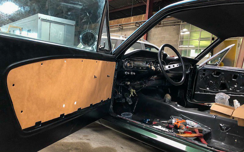 Rather than replacing everything with aftermarket parts, Rudy chose to restore the original door mechanisms for durability and authenticity.