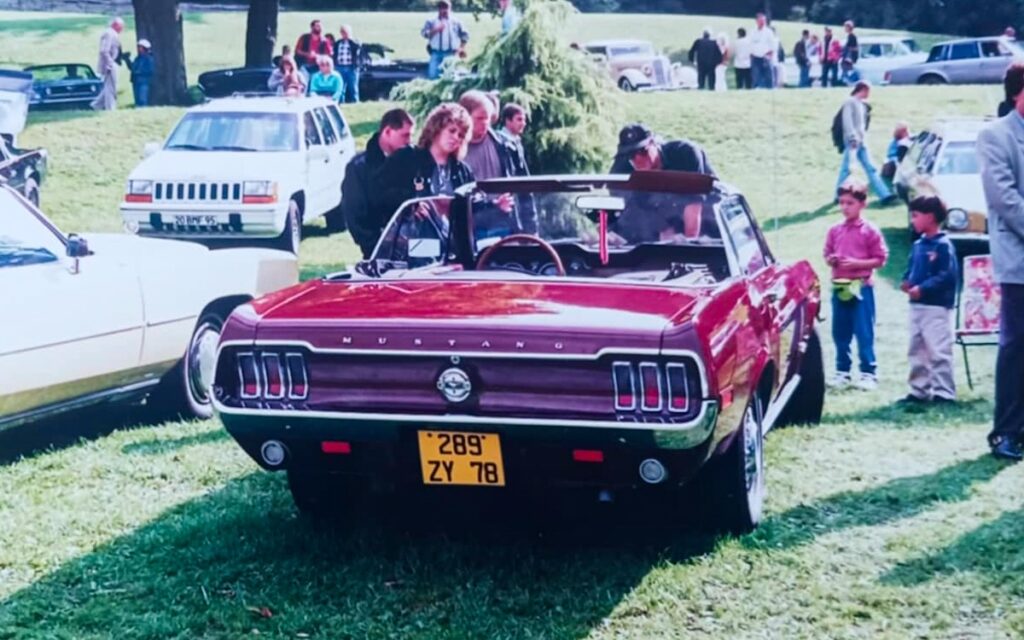 1968 Mustang convertible displayed at a classic car gathering in France