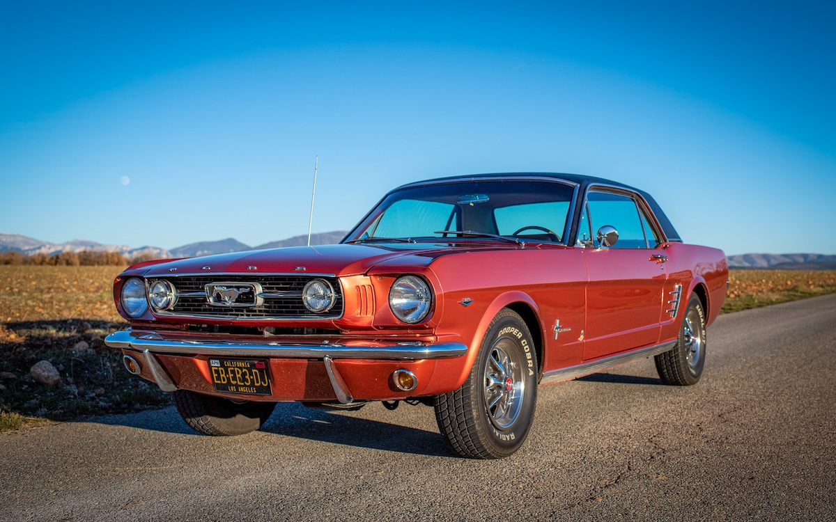 1966 Mustang Emberglo driving on French countryside roads