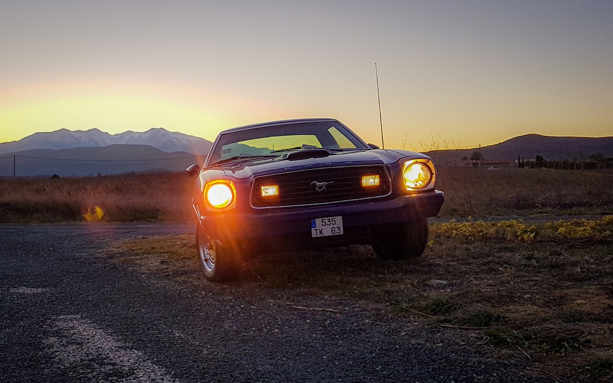 Restoring a 1975 Mustang II fully completed, Bryan’s blue Mustang II photographed at sunset