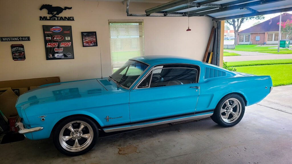 The Mustang in the family garage, where John continues to care for it more than half a century after purchasing it. Photo credit: Johnny Kovalick