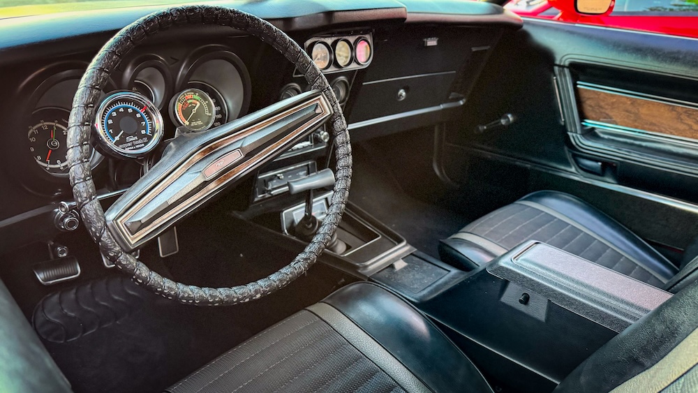 Interior of Heather's 1973 Mustang Mach 1 with center console and auxiliary gauges
