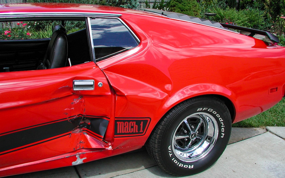 Damaged driver side of the 1973 Mustang Mach 1 after the 2006 Woodward accident