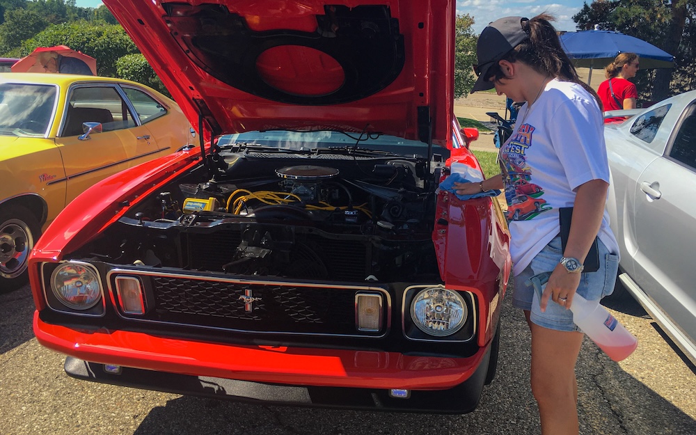 Heather detailing her 1973 Mustang Mach 1 at Lakeside Mall in 2023