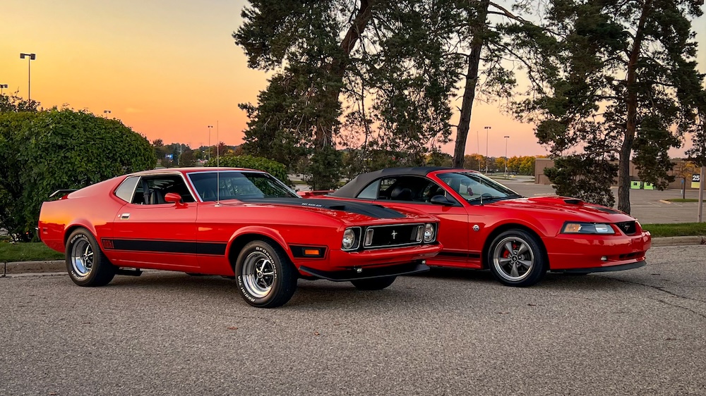 Heather's 1973 Mach 1 beside her 2004 Mustang GT Convertible DemonGT